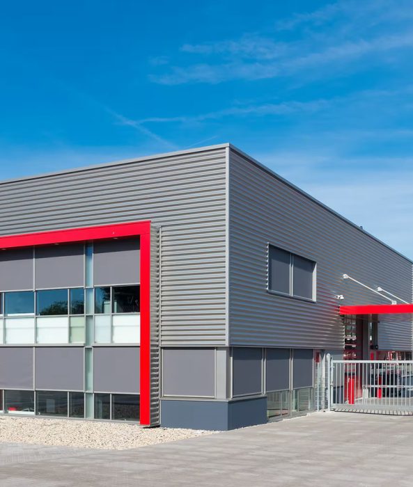 Commercial development: a modern industrial building with metal cladding